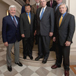 Small_men_in_suits